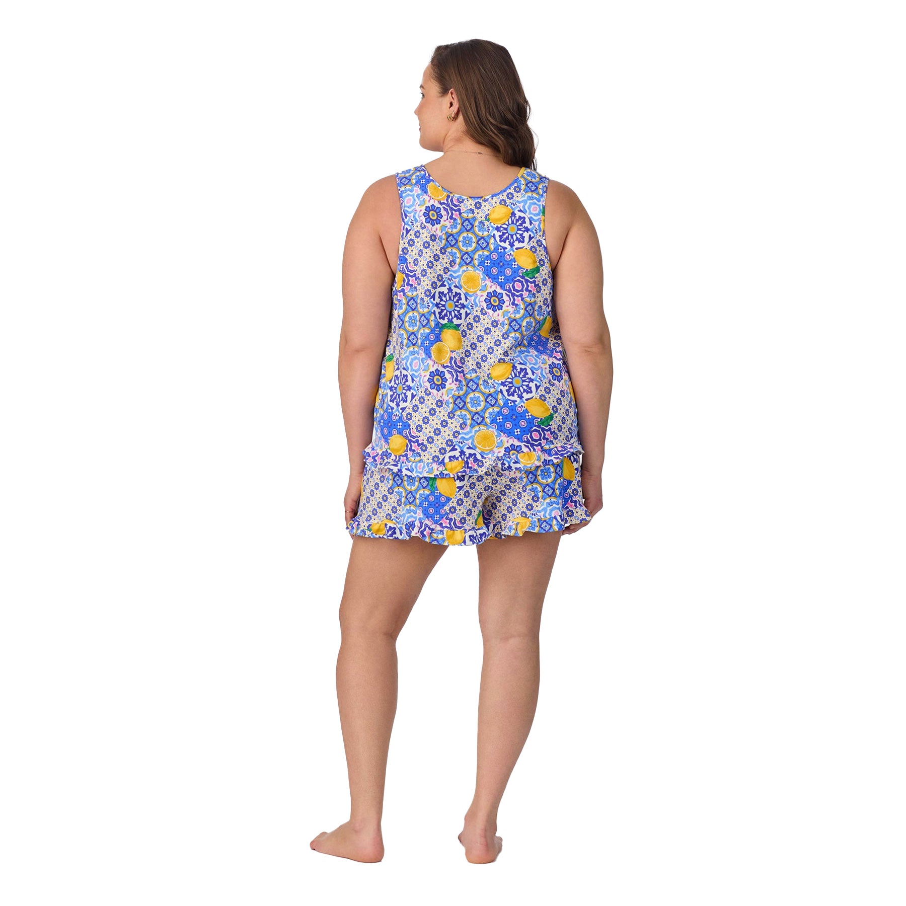 Back view of a plus-size model in the same sleeveless lemon-printed pajama set.