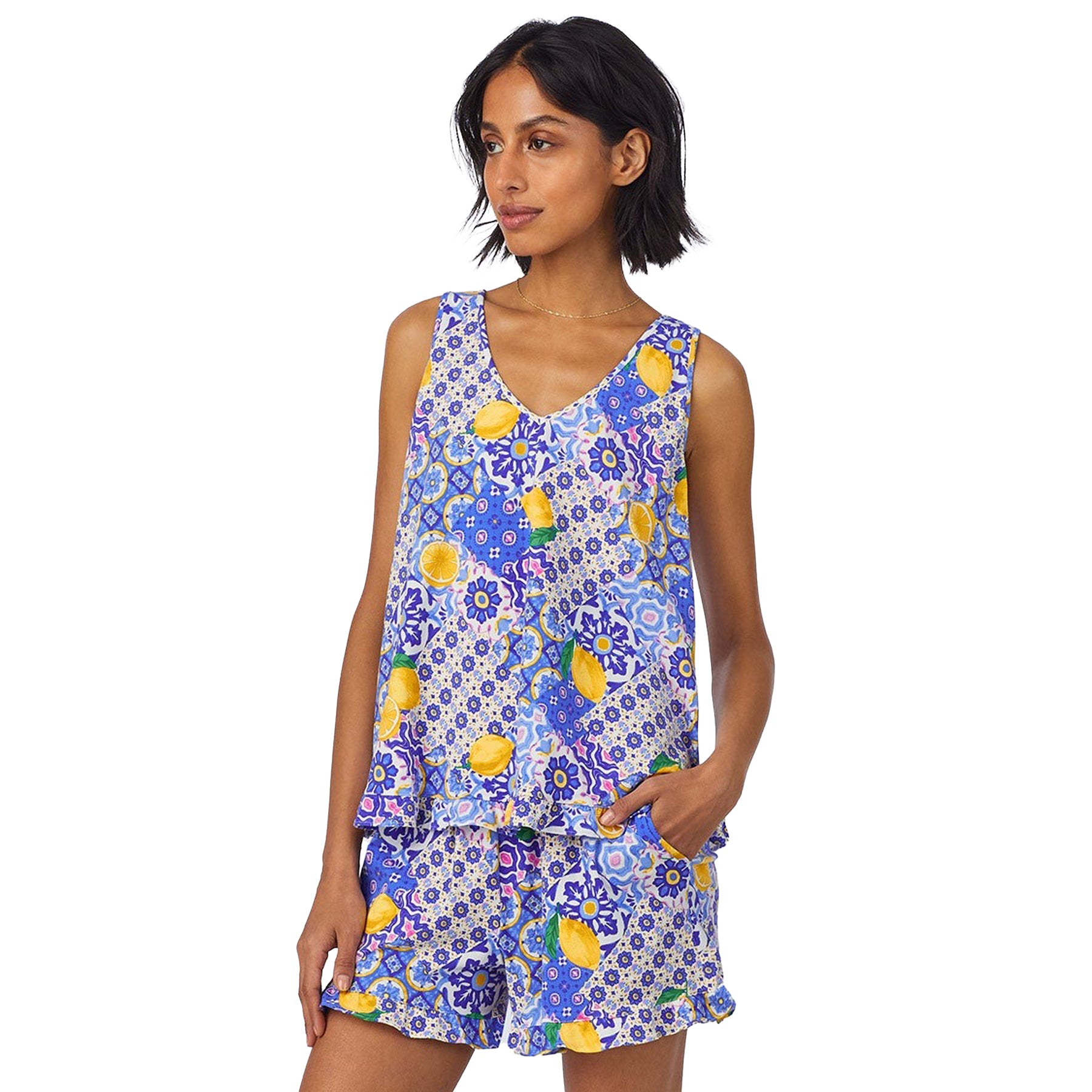 Close-up front view of the lemon print sleeveless top and matching shorts with pockets on model.