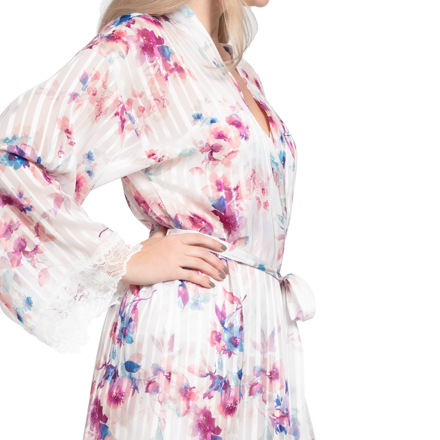 Side view of the robe showing the belted waist, soft drape, and lace-trimmed sleeve with vibrant floral details over a striped sheer base.