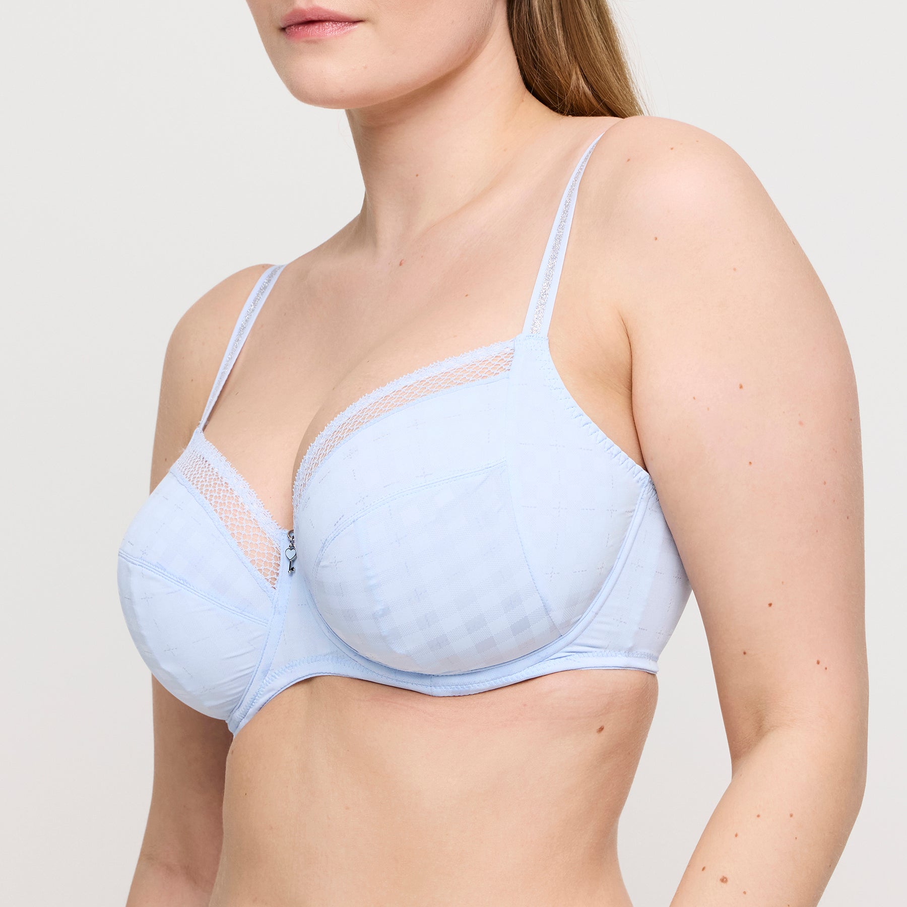 Side view of Twist Chikone full cup bra in Heaven Blue, highlighting underwire support and lace-accented upper cup.