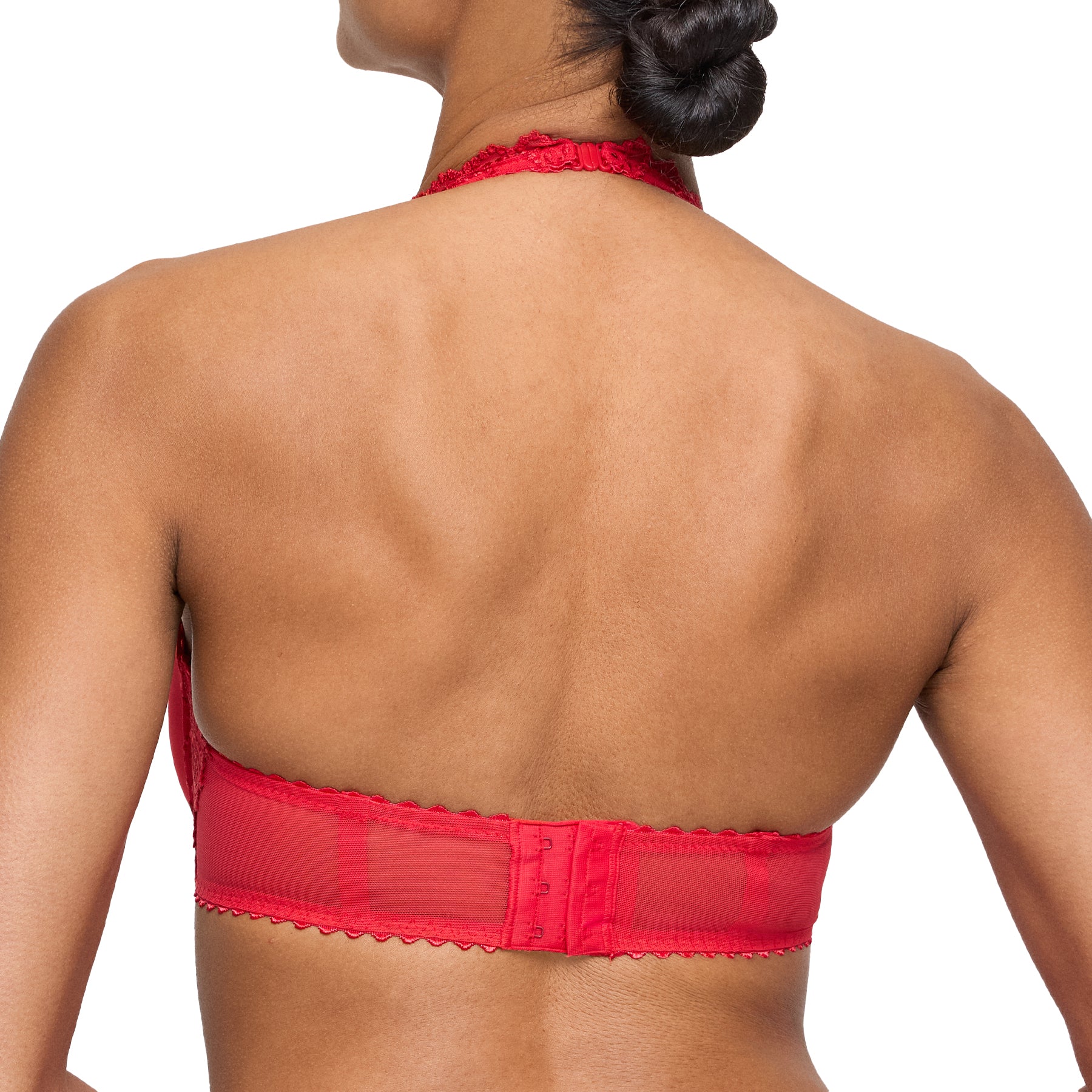 Close-up of red padded lace bra with pearl-accented bow details and floral embroidery.