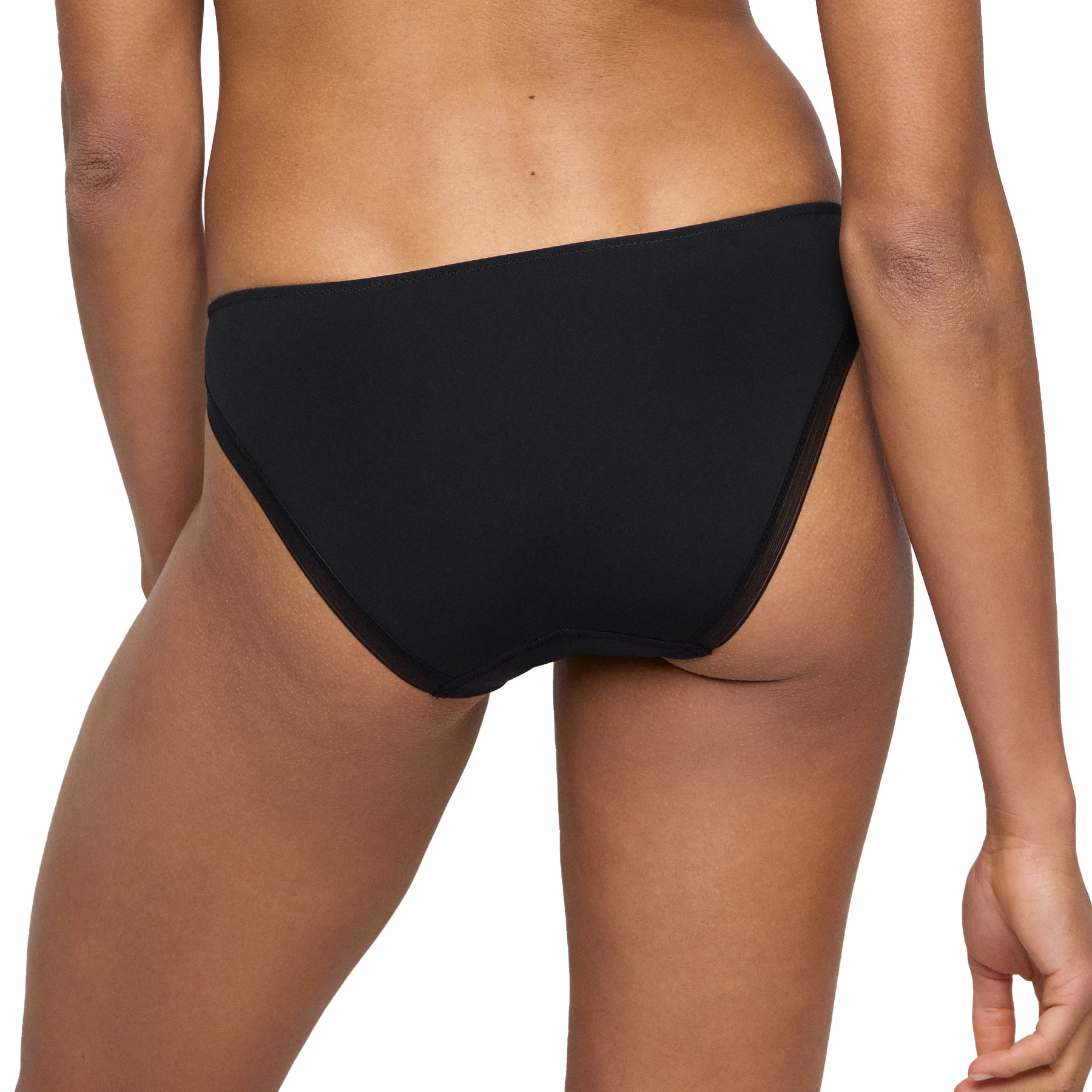 Back view of seamless black thong - shown on model.