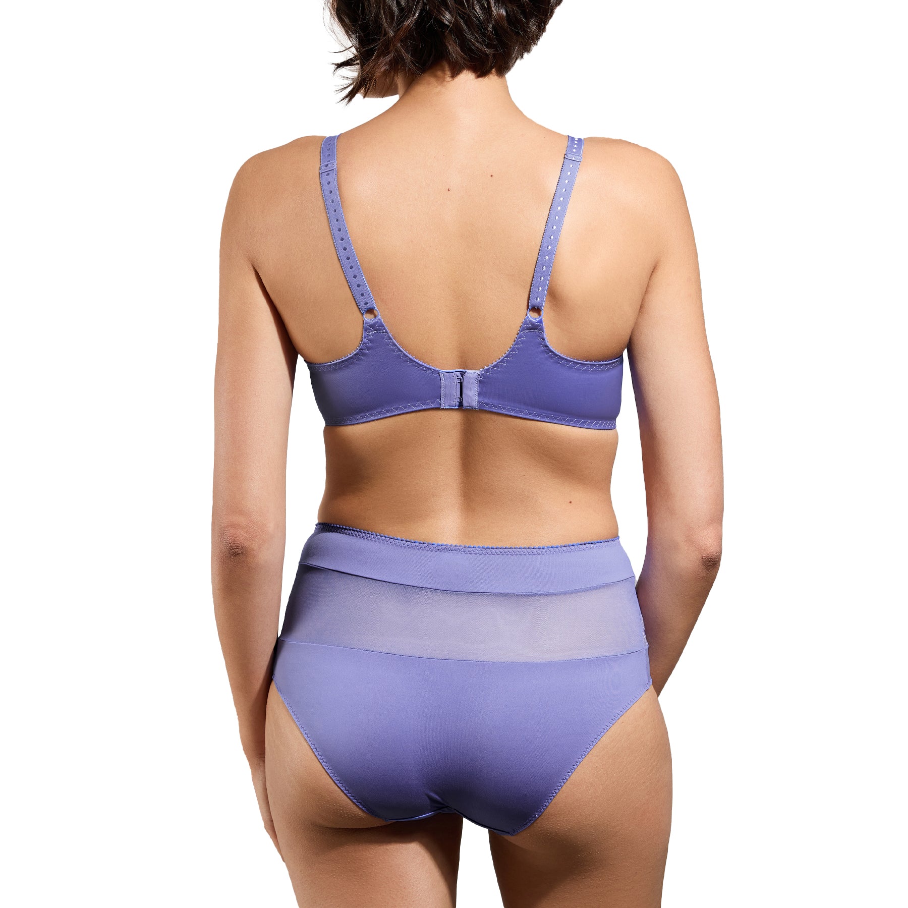 A back view of the model wearing the lavender lace bra and coordinating high-waisted panties, highlighting the adjustable straps and seamless, smoothing fit.