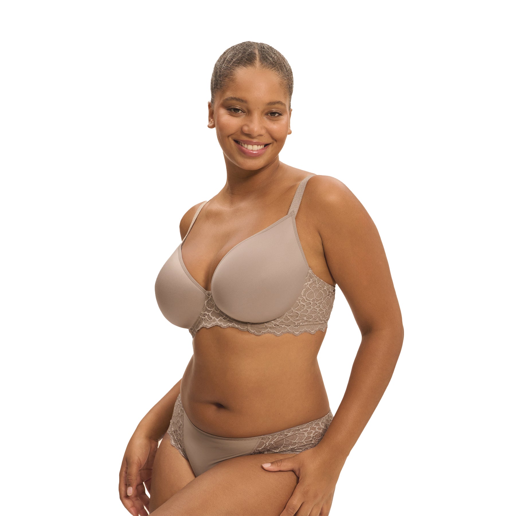 A model showing a grey/nude set of lacey basic lingerie from Simone Perele on a white background, side view.