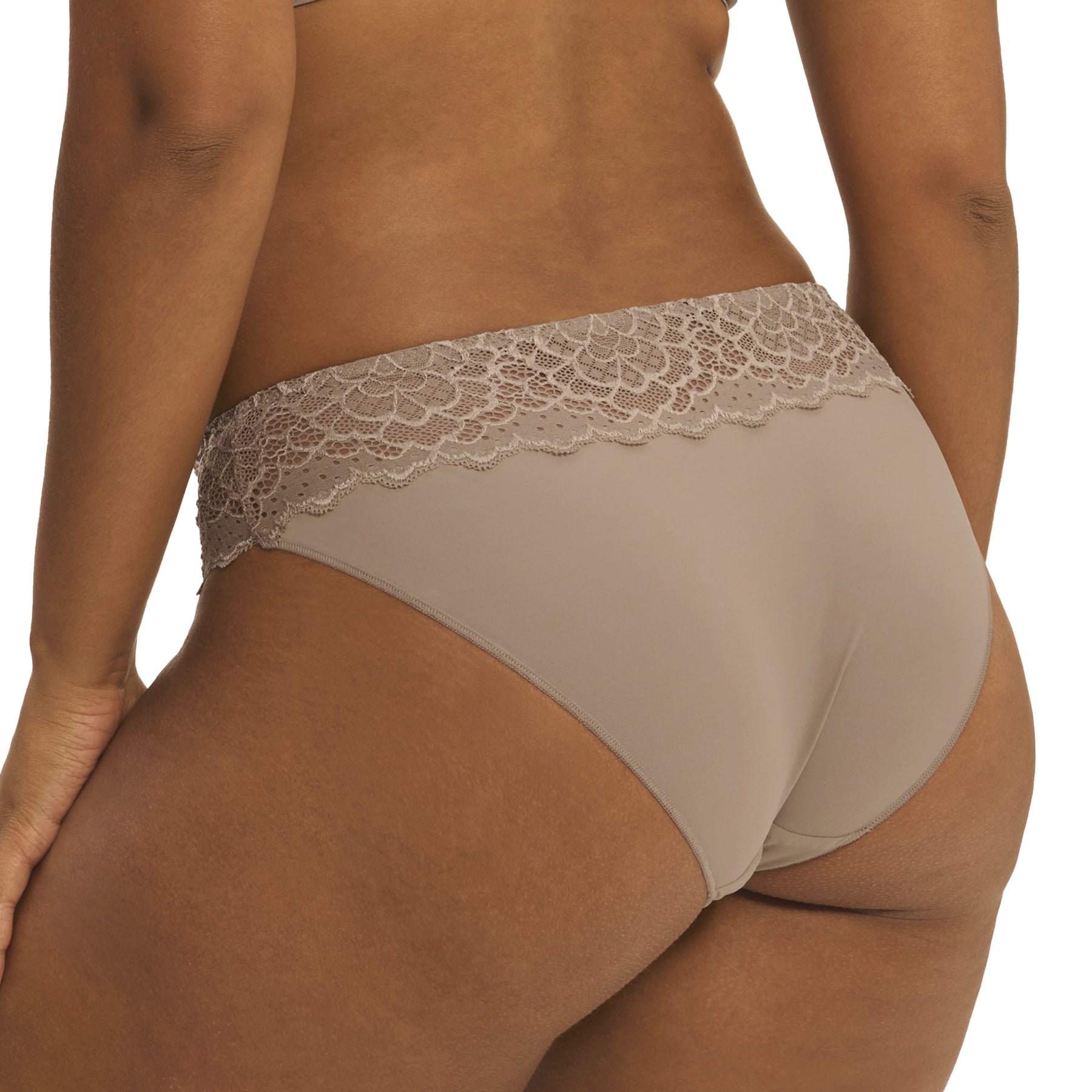 A model showing a grey/nude bikini brief seamless panty on a white background., back view, close-up.