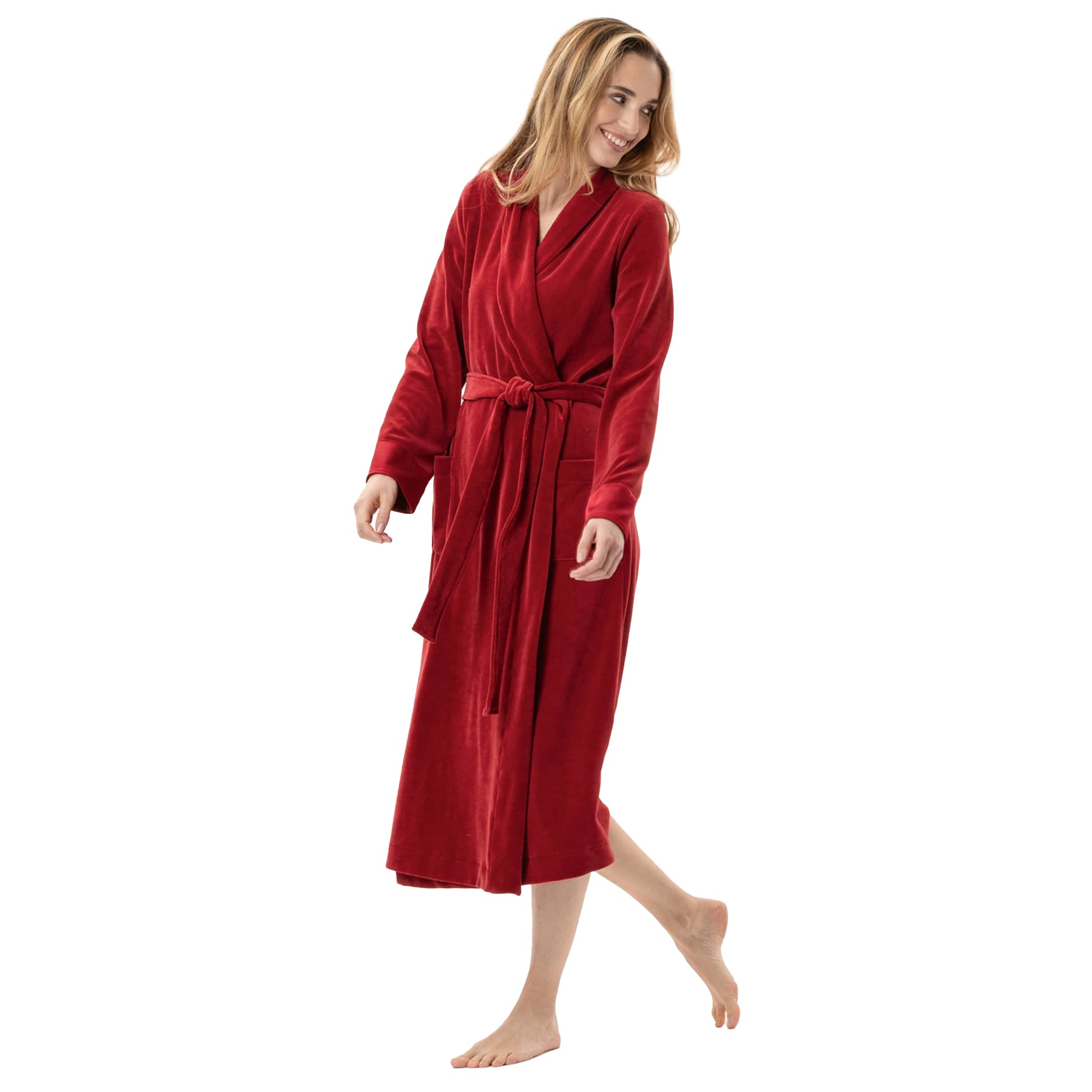 A playful pose of a woman showing a red robe.