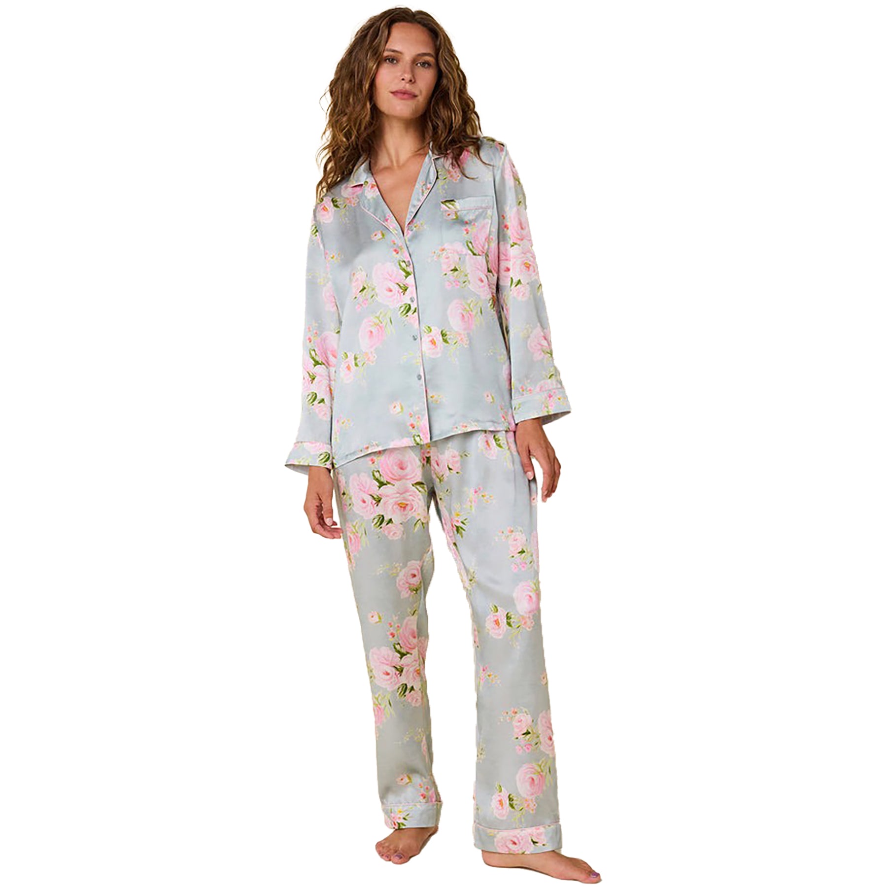 100% silk classic button up pajama set in a multicolour floral print on a light blue background. Front view on model.