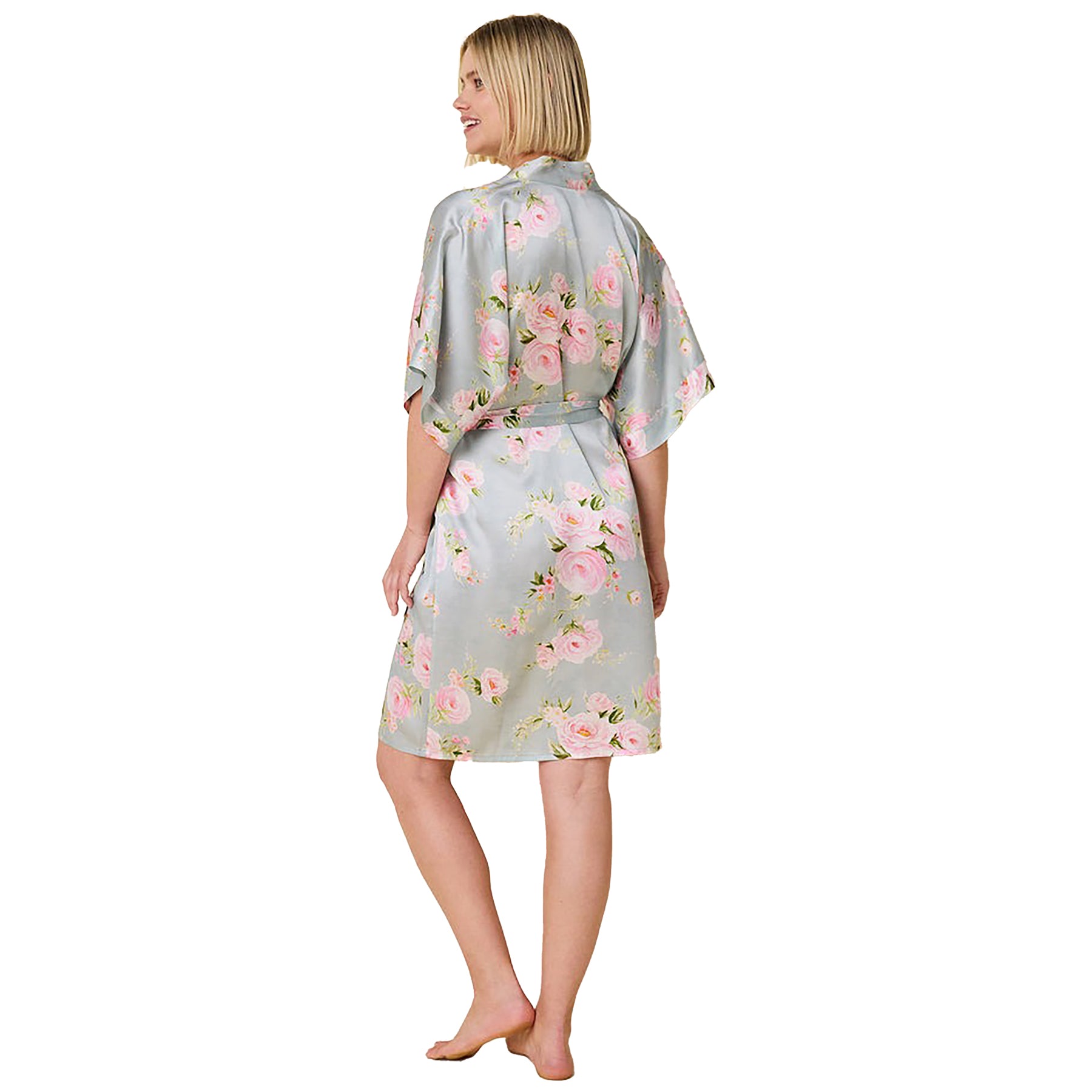 100% silk kimono sleeve short wrap robe in a multicolour floral print on a light blue background. Rear view on model.