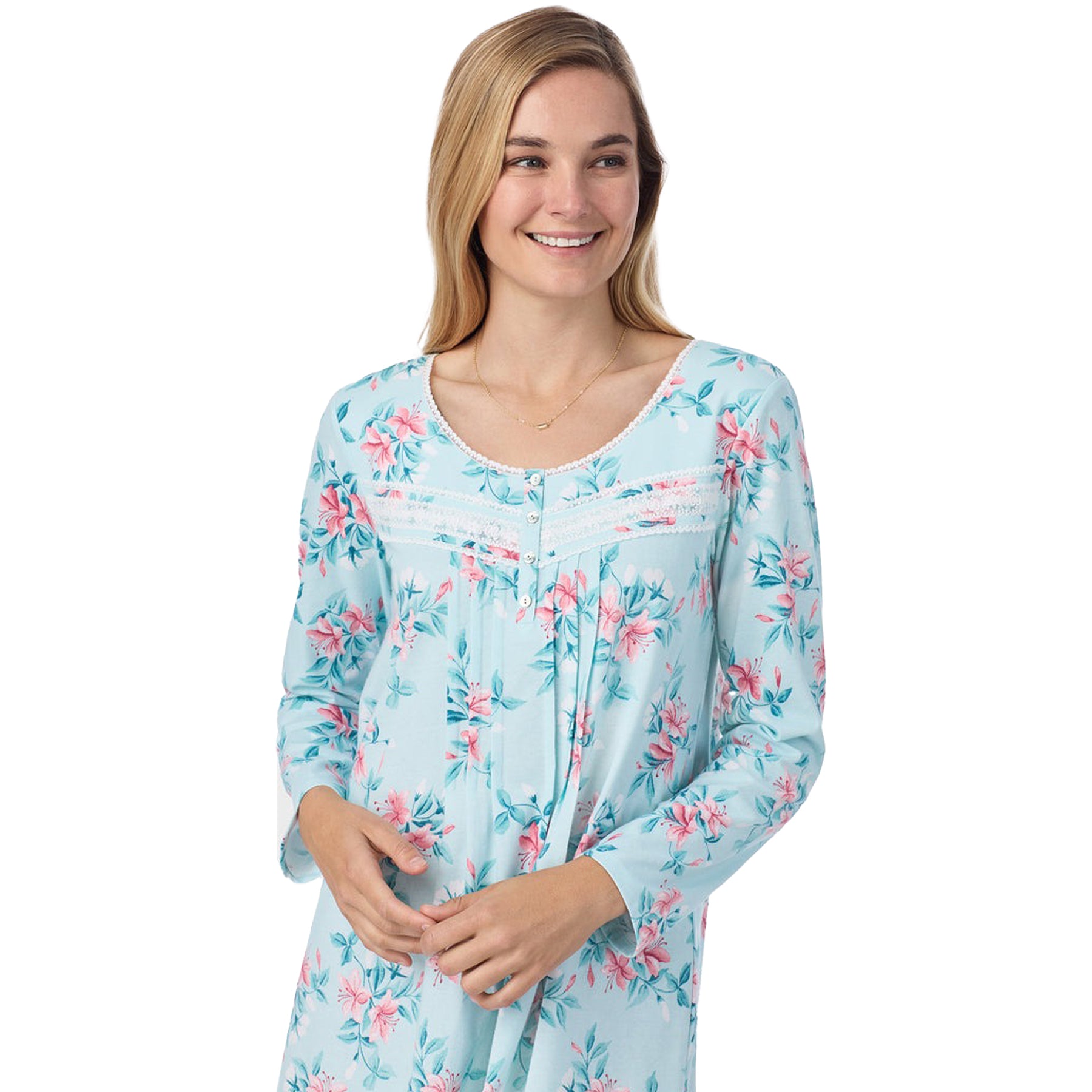 Close-up view of a women's floral nightshirt in a "teal floral" print showcasing intricate lace trim and button detailing, fashion photoshoot.