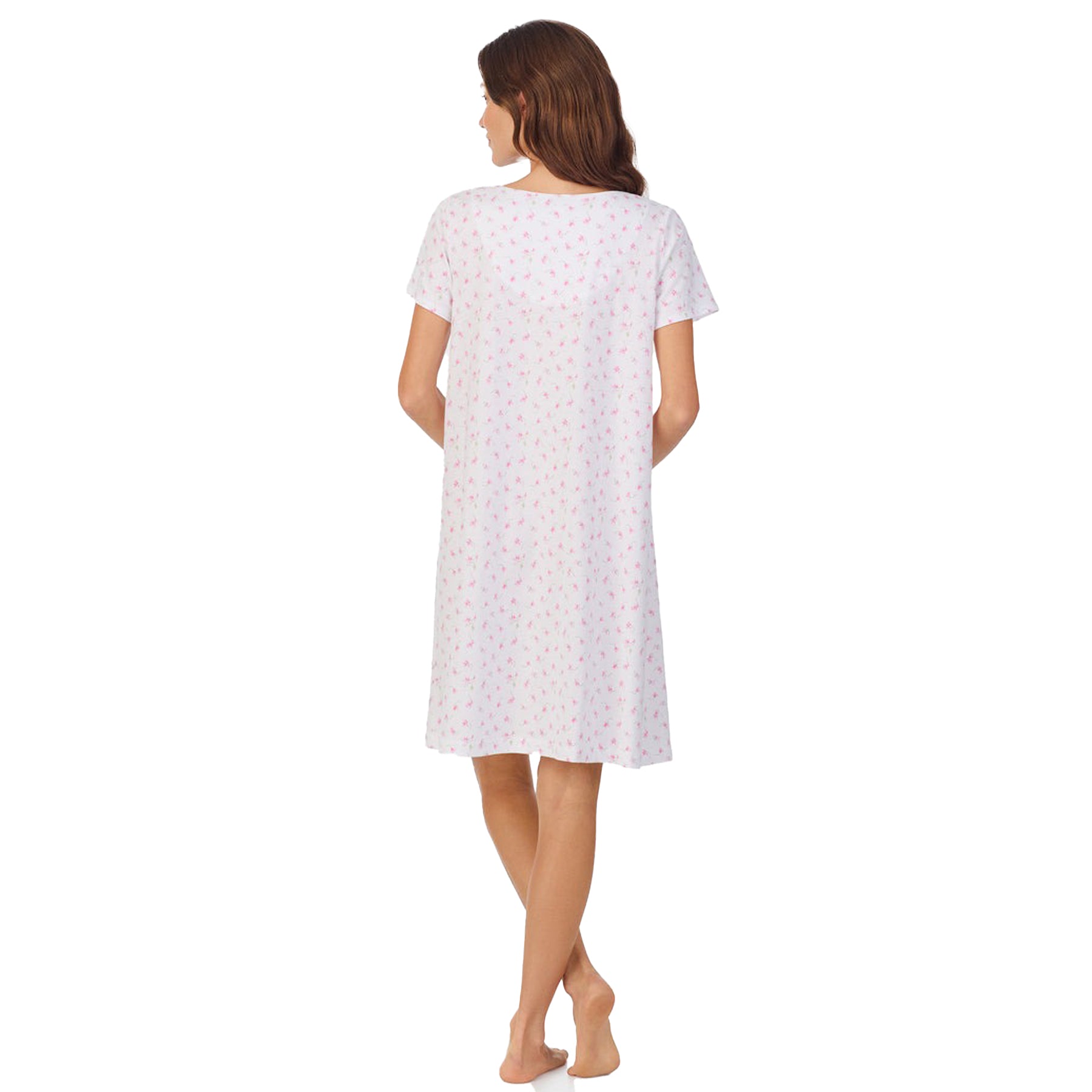 Back view of a women's floral nightshirt in a "petite pink floral" print showcasing intricate lace trim and button detailing, fashion photoshoot.