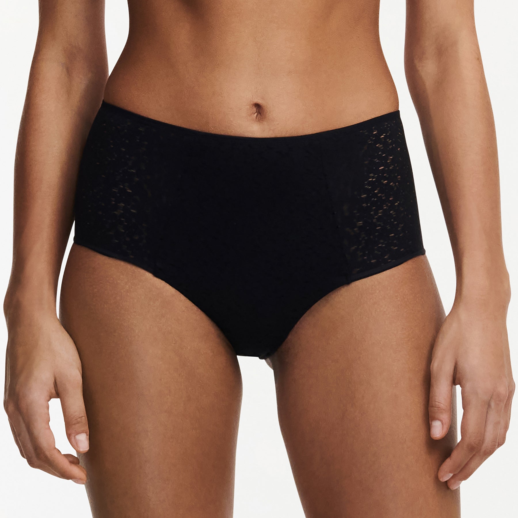 Chantelle light control Norah full brief with floral lace in black. Front view on model.