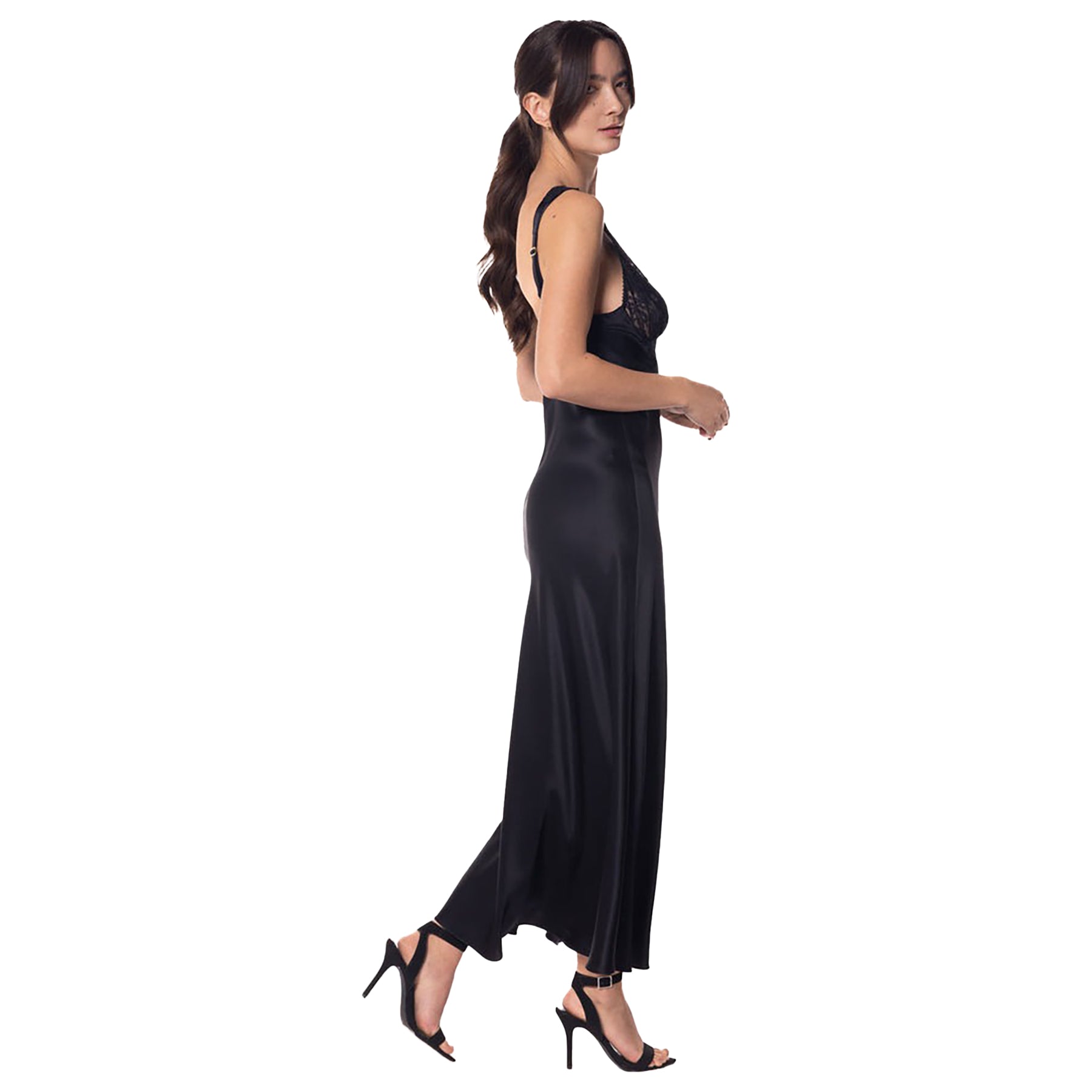 Long silk gown in kohl black with lace v-neck bodice. Side view on model.