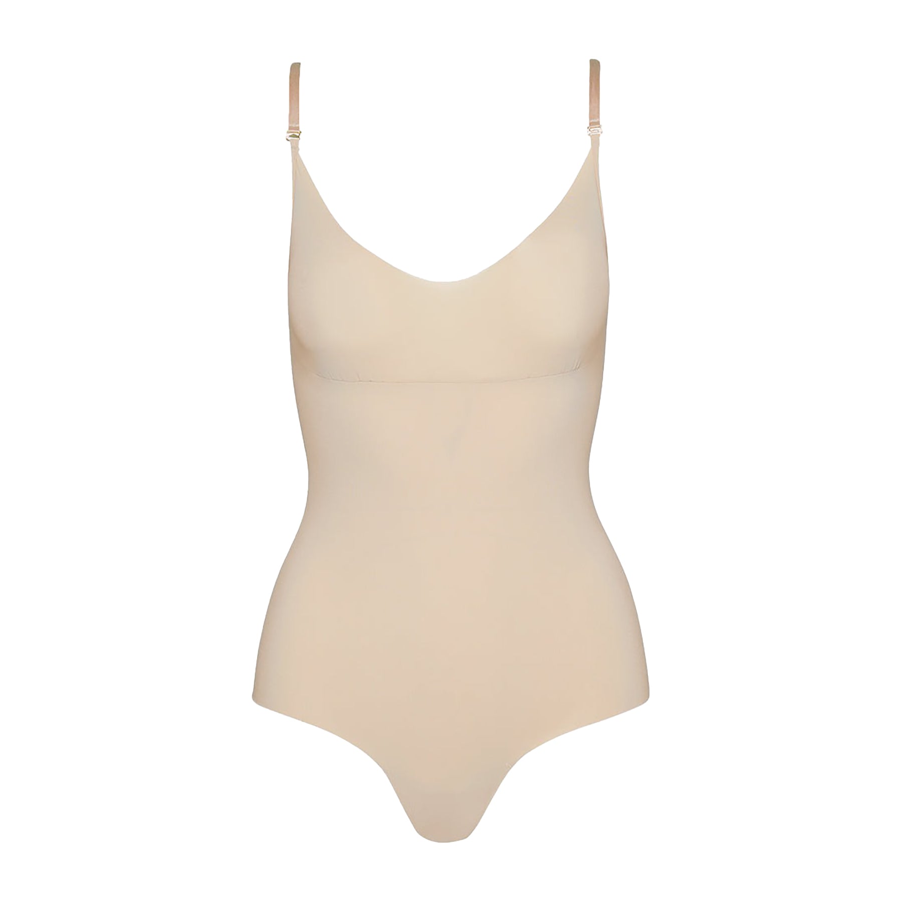 Seamless camisole bodysuit with thong back in nude. Front view without model.