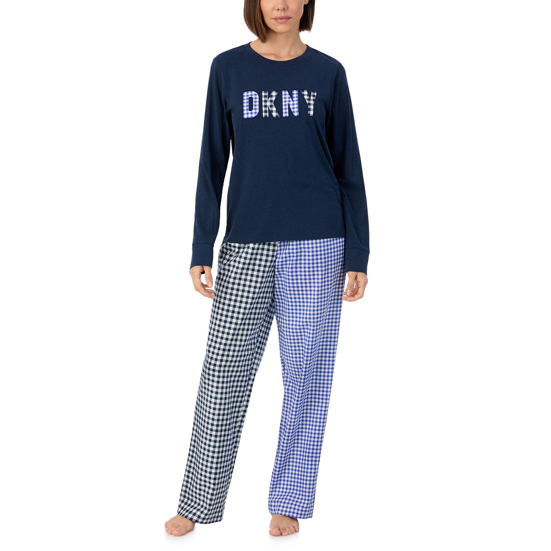 Long sleeve navy blue lounge top with DKNY gingham logo with matching black and blue gingham printed pants. Front view on model.