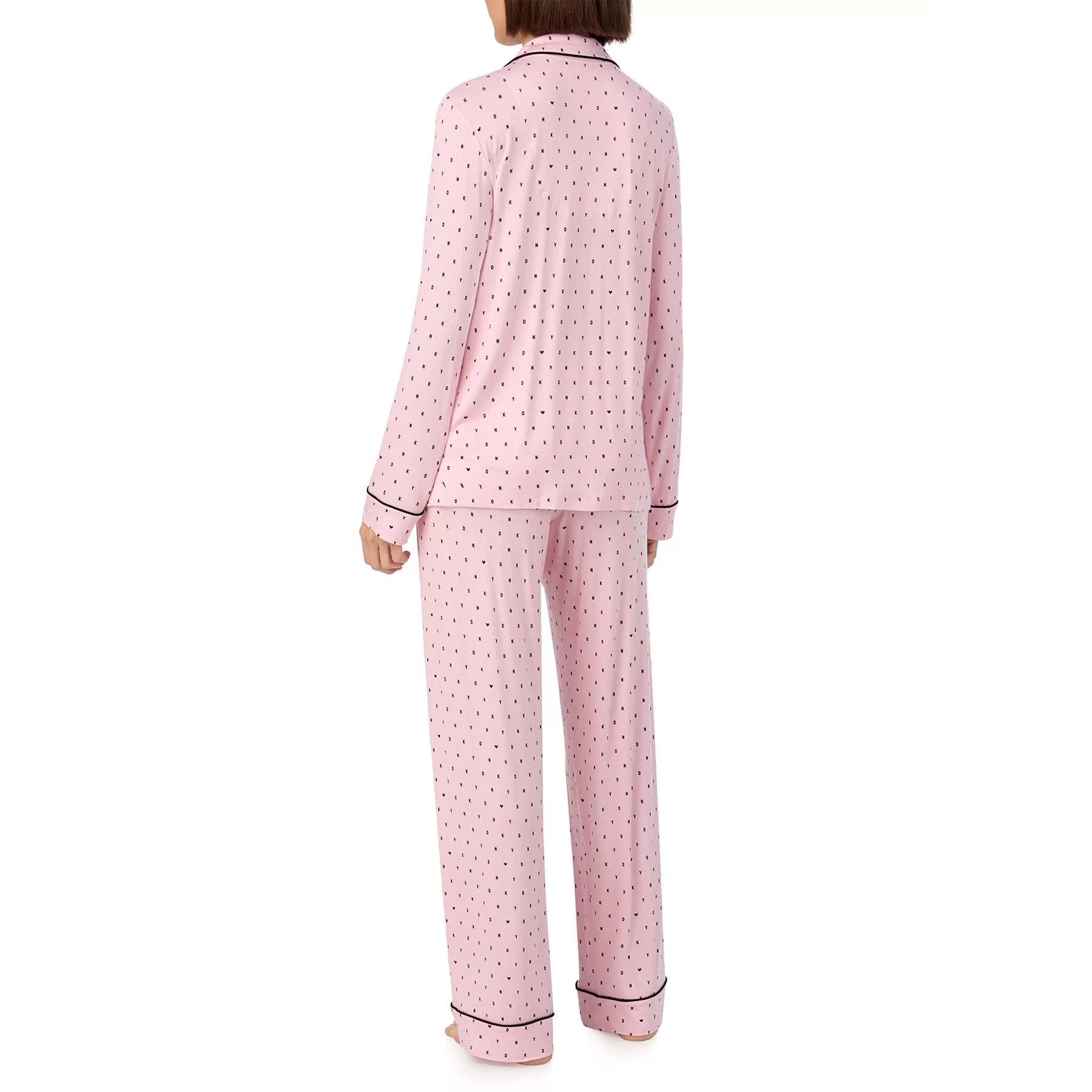 Classic button up 2-piece pyjama set in DKNY black mini logo and heart print on baby pink background. Rear view on model.