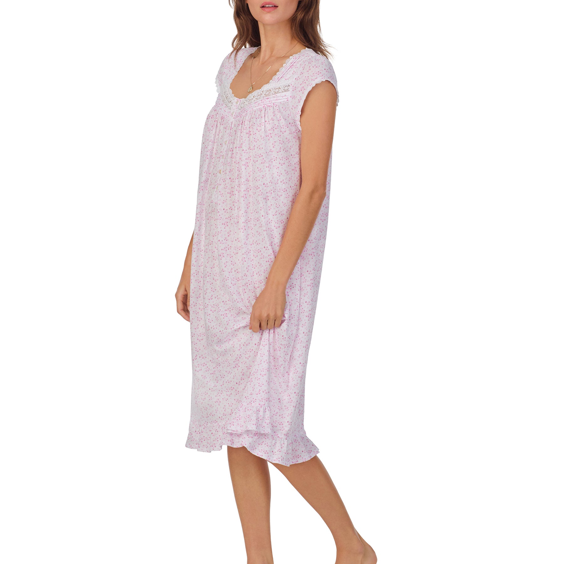 Front/Side view of a women's floral nightshirt in a white pink ditsy print, showcasing intricate lace trim, button detailing, and cap sleeves.