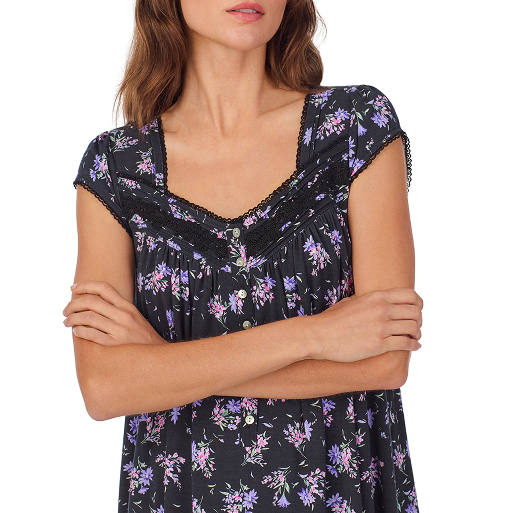 Close-up view of a women's floral nightshirt in a black garden bouquet print, showcasing intricate lace trim, button detailing, and cap sleeves.