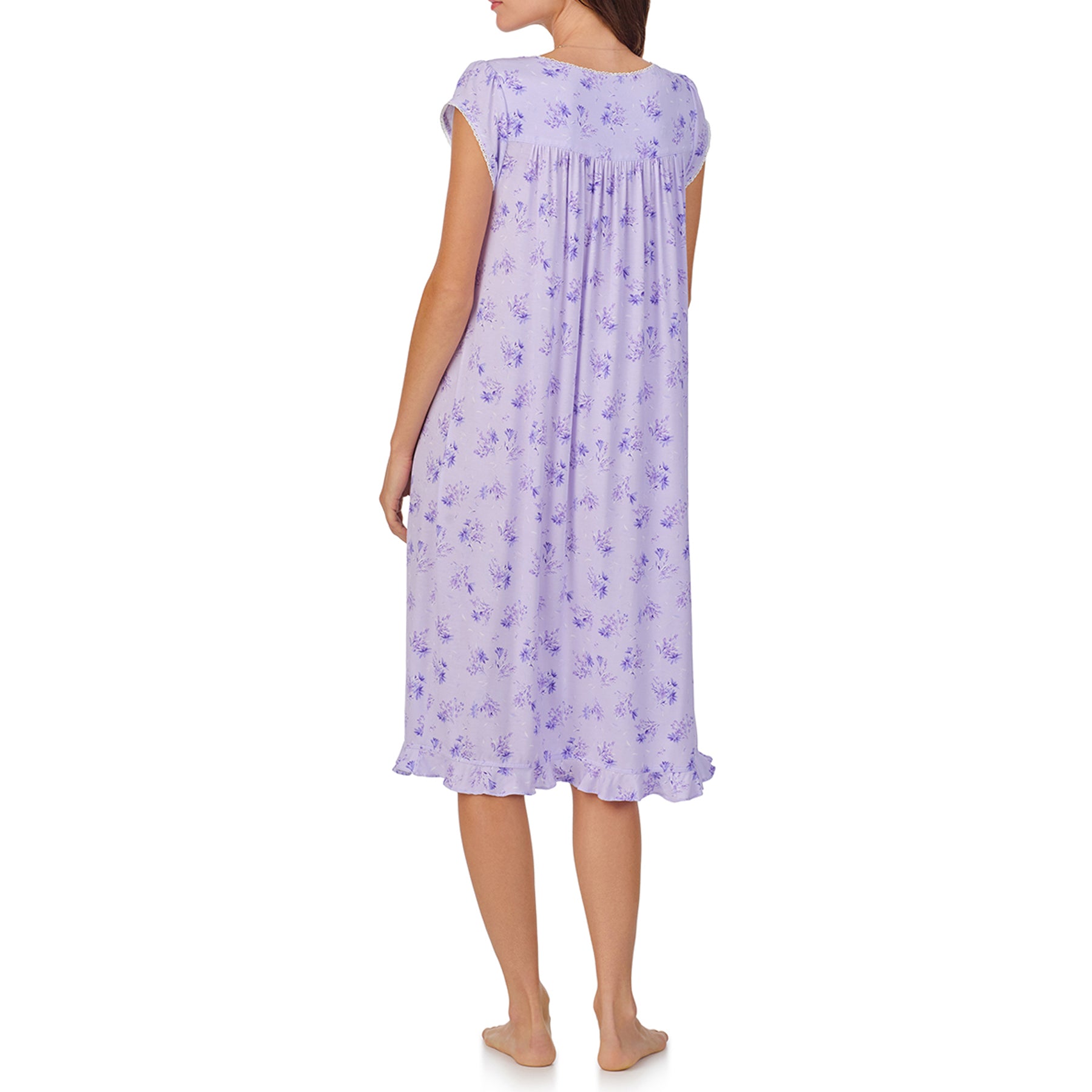 Back view of a women's floral nightshirt in a lilac garden bouquet print, showcasing intricate lace trim, button detailing, and cap sleeves.