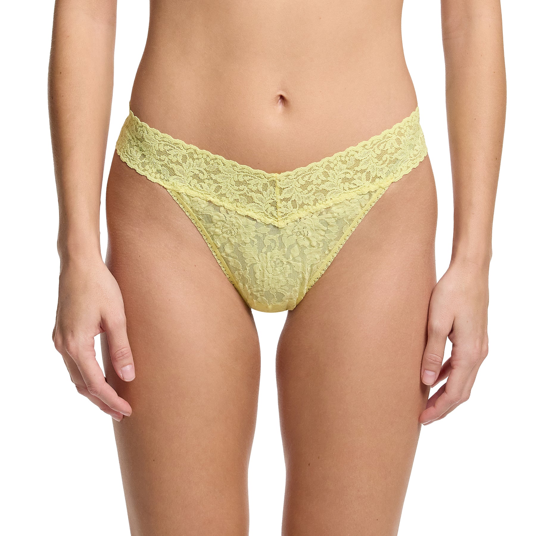 Hanky Panky lace original rise thong in  it's bananas pale yellow, front view on model.