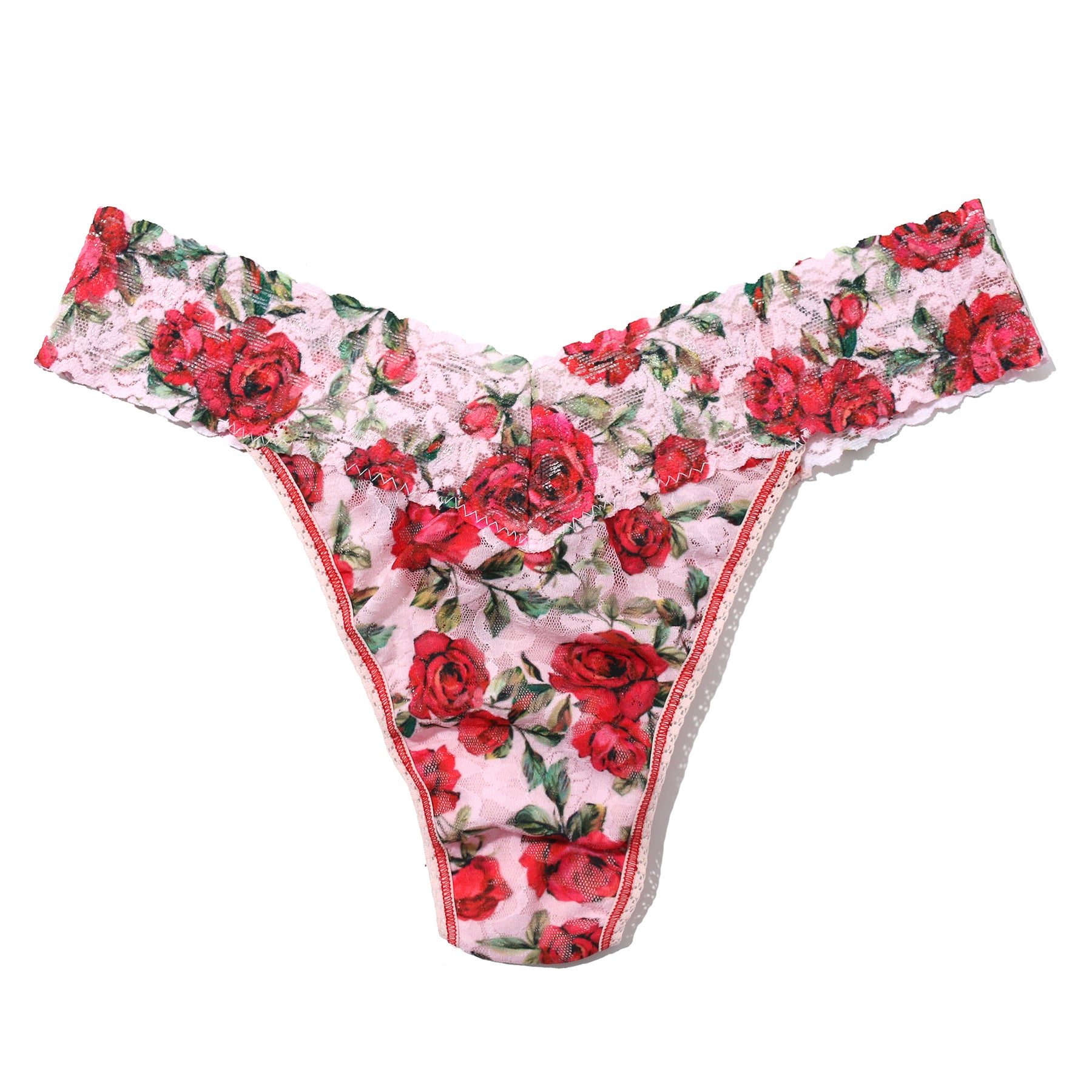 Je t'aime floral red/green rose printed lace original rise thong on a light pink background. Front view without model.