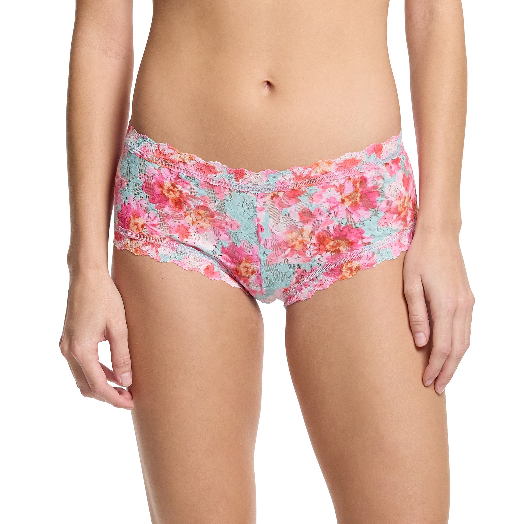 Hanky Panky printed lace boyshort in first bloom, pink and orange florals on a blue aqua background. Front view on model.