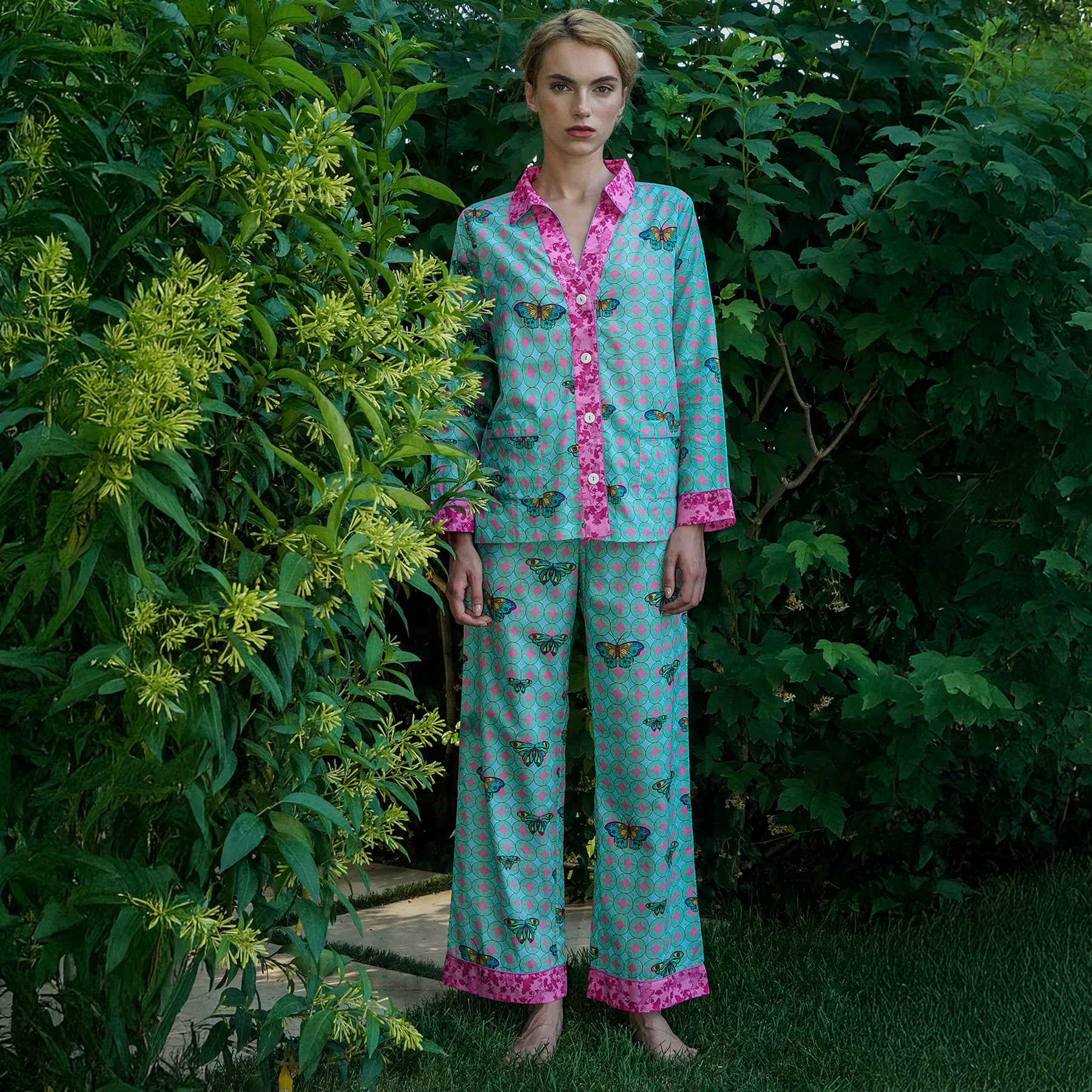 Kaze aqua/chocho rose hot pink and turquoise printed cotton classic button up pyjama set. Front view on model.