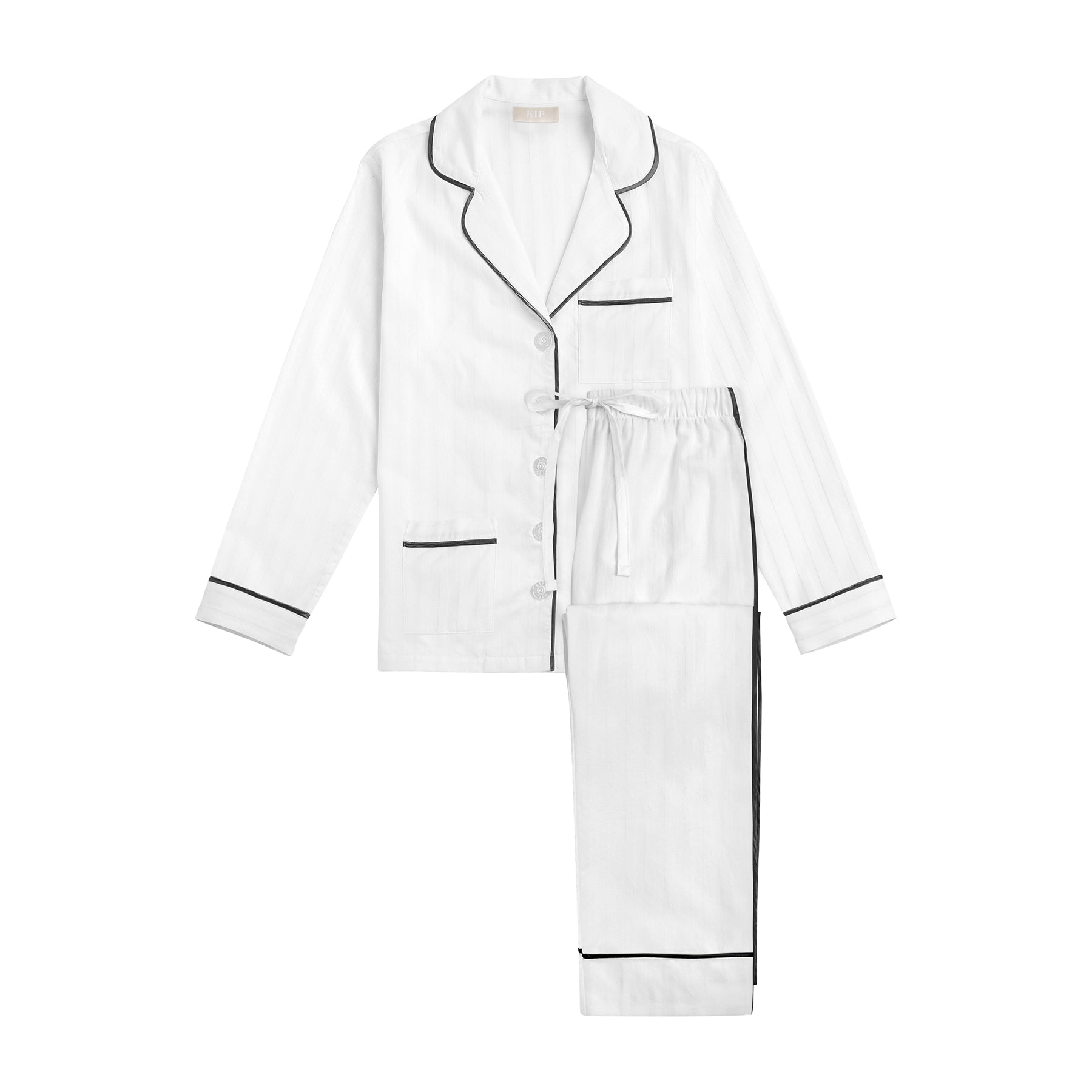 White cotton classic pyjama set with contrast black piping. Front view without model.