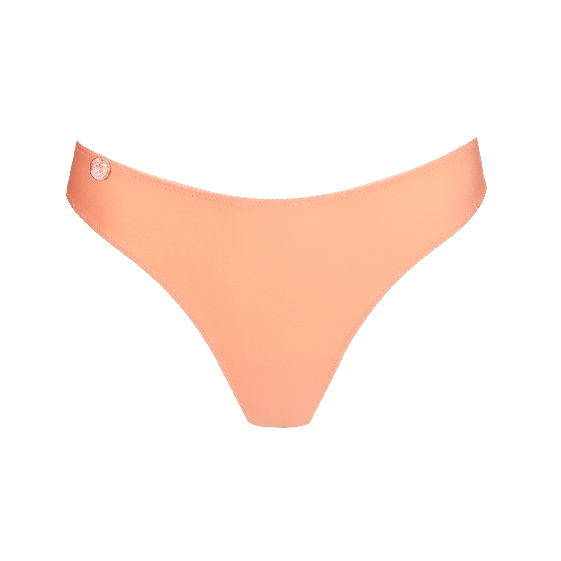 Seamless thong panty in papaya smoothie light orange. Front view without model. 