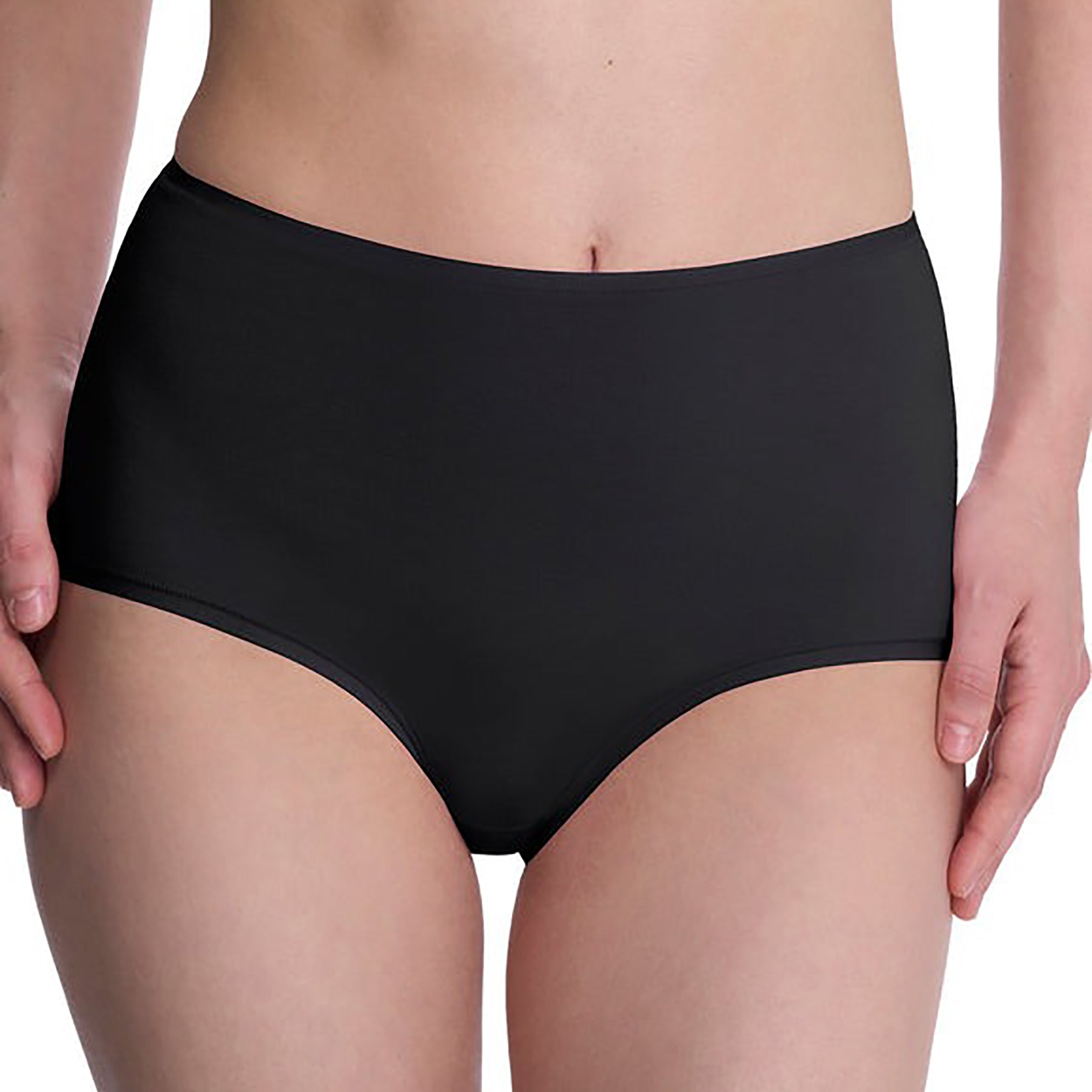 Seamless pima cotton high-rise full brief in black. Front view close up on model.