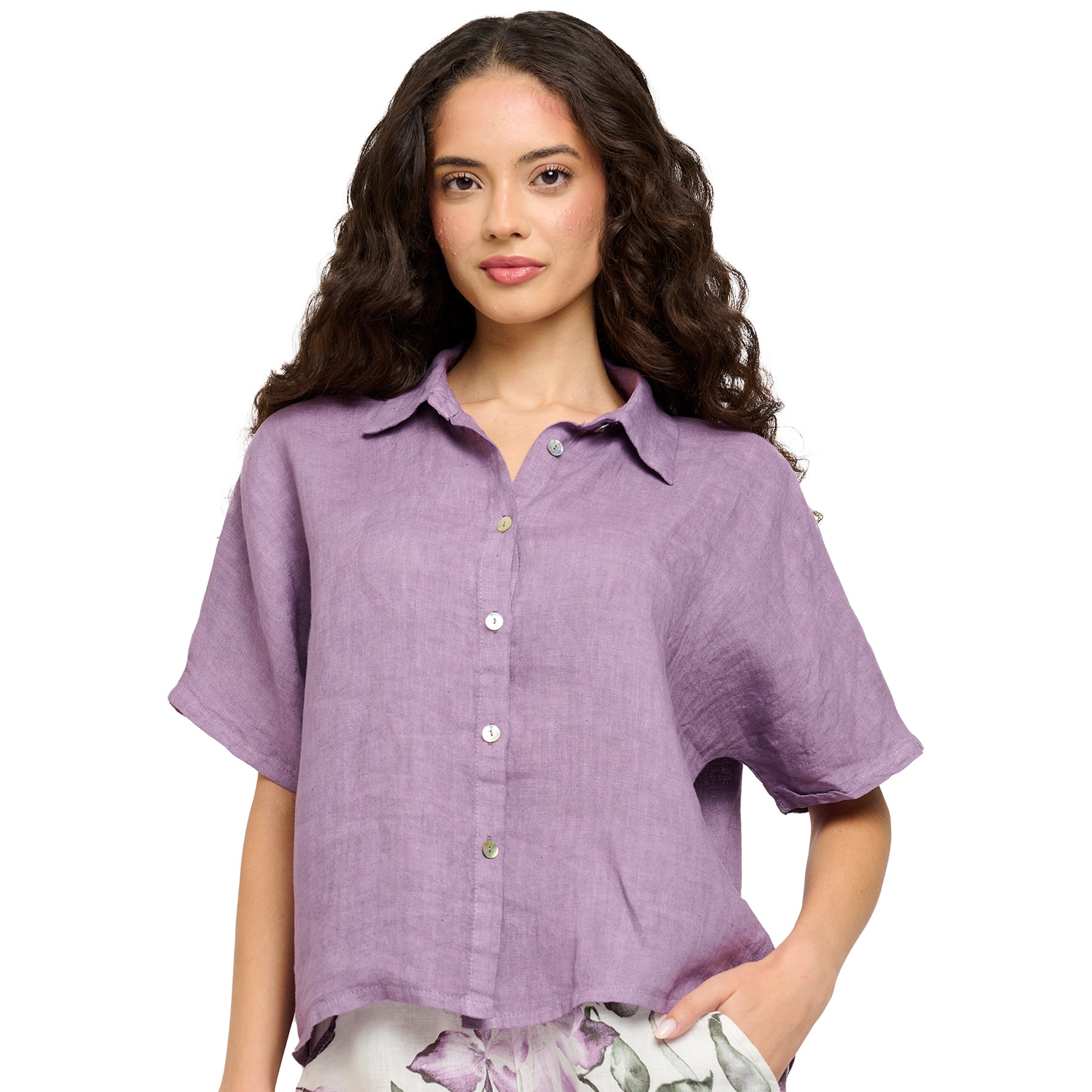 Short sleeve button up linen blouse in blackberry purple. Front view on model.