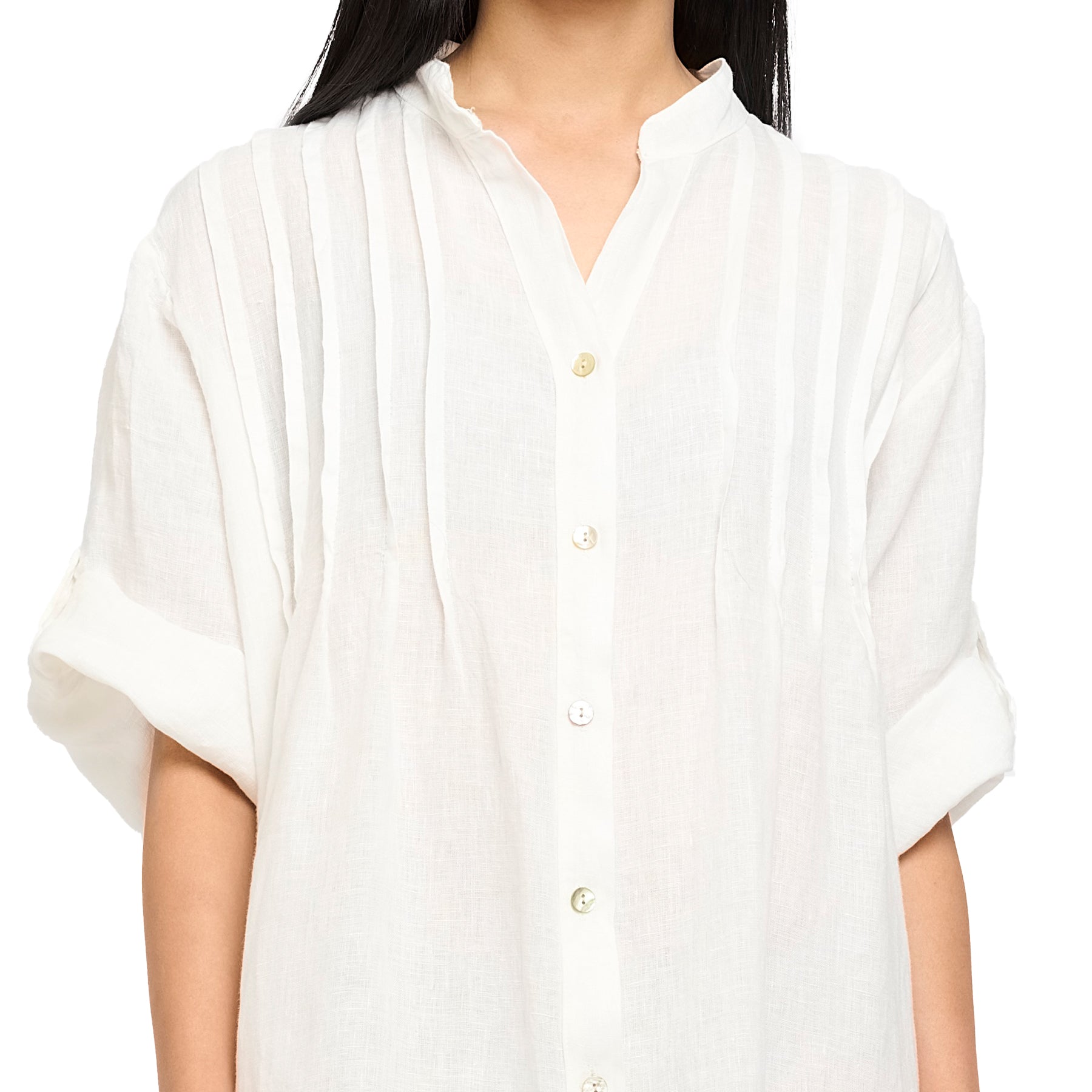 Roll up sleeves, button up, mock neck, pleated front linen dress in white. Front view close up on model.