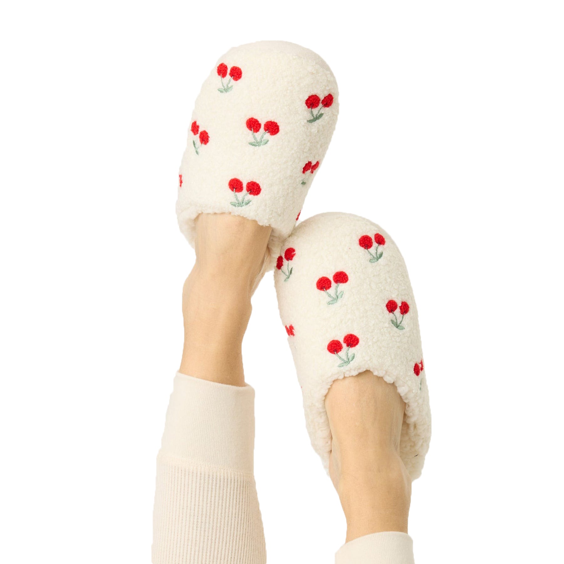 Fuzzy and fleecy slippers in ivory with red cherry print.