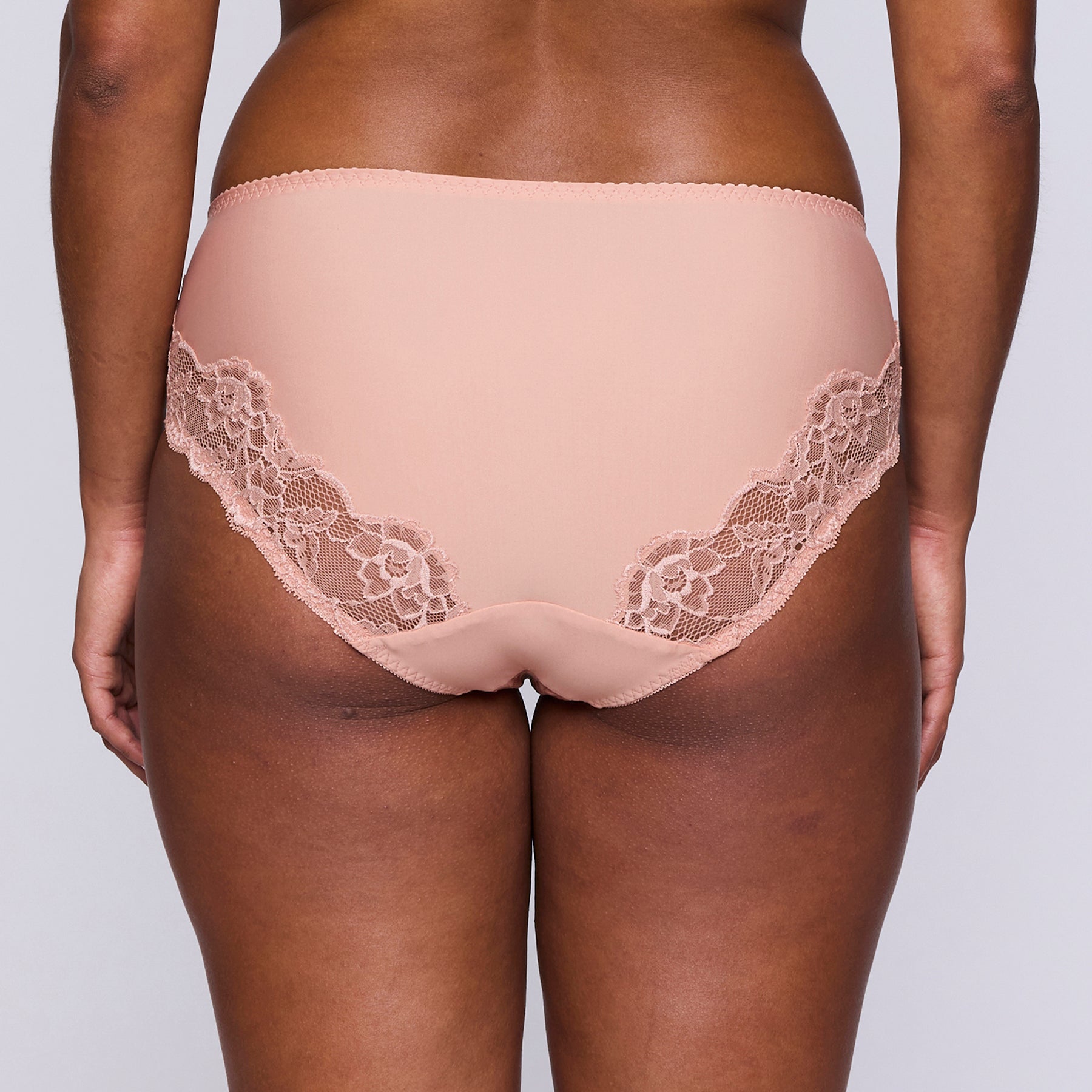 Full brief in tonal leopard print on a dusty rose background. Rear view, on model.