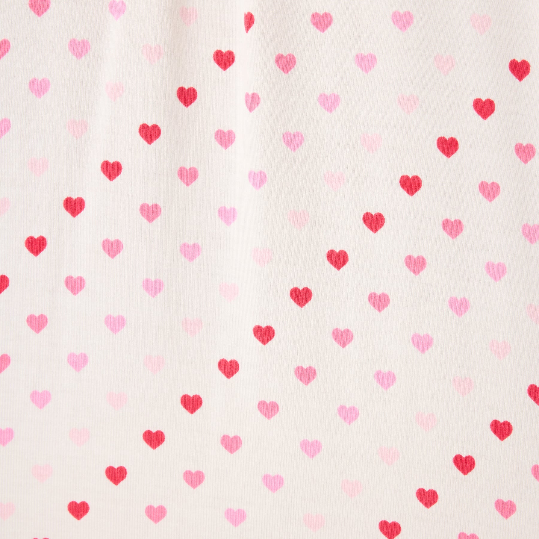 A heart print on the ivory fabric, closer look. 