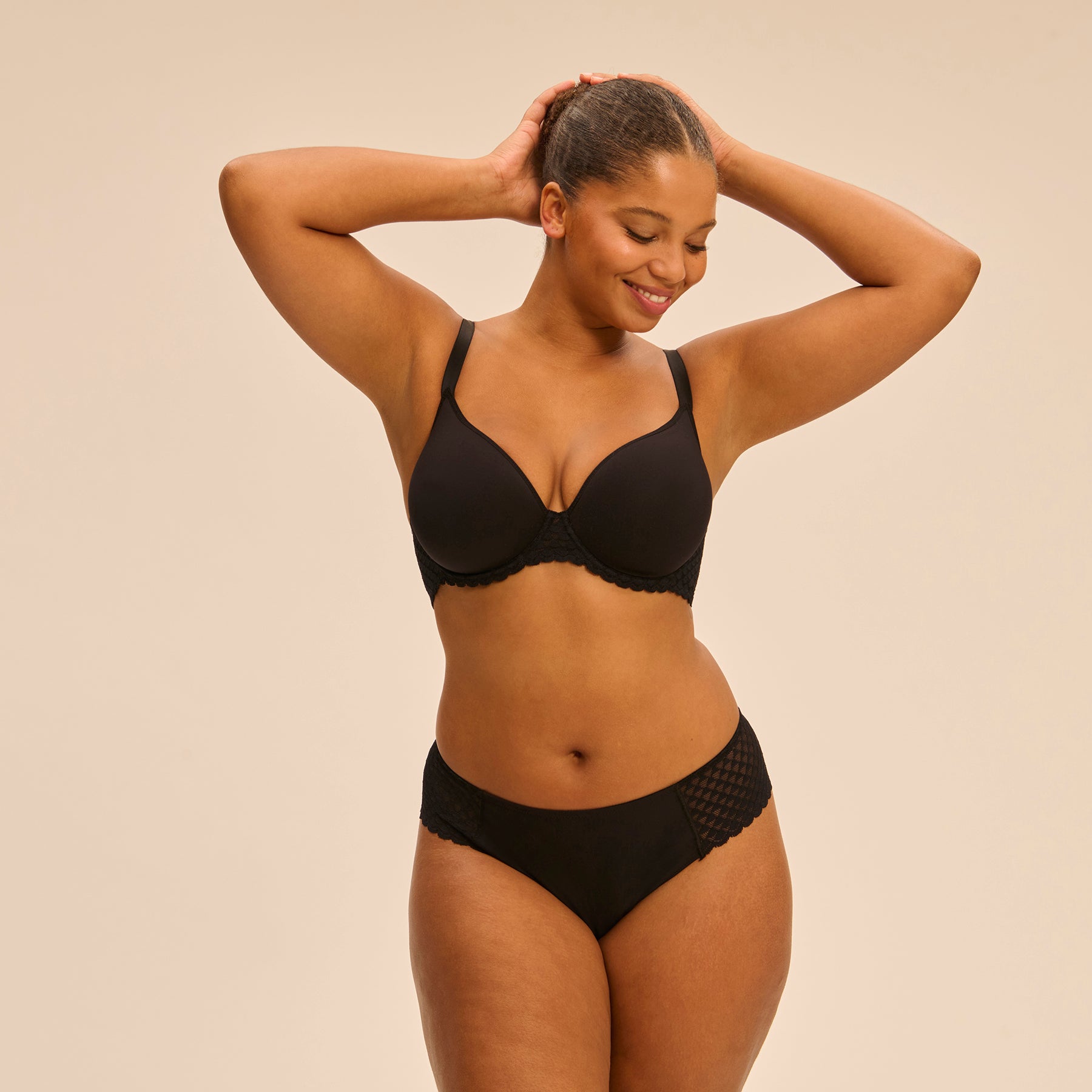 Plunge 3D spacer bra in black with interlocking lace band. Front view, on model.